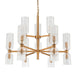 Gold chandelier with clear glass shades on a white background