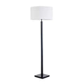 Floor lamp with a white shade and black base on a white background