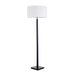 Floor lamp with a white shade and black base on a white background