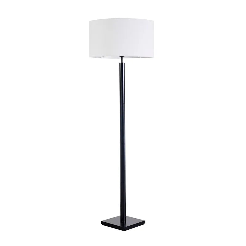 Floor lamp with a white shade and black base on a white background