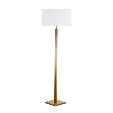 Floor lamp with a white shade and gold base on a white background
