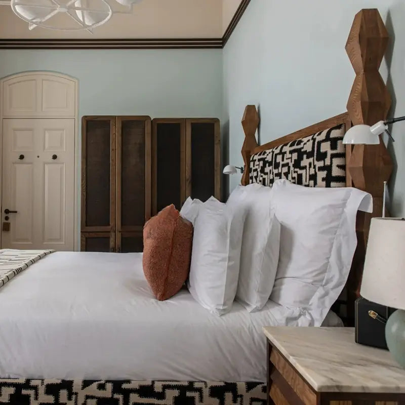 Pierre Elegant Soft Upholstered Pillar Bed Design