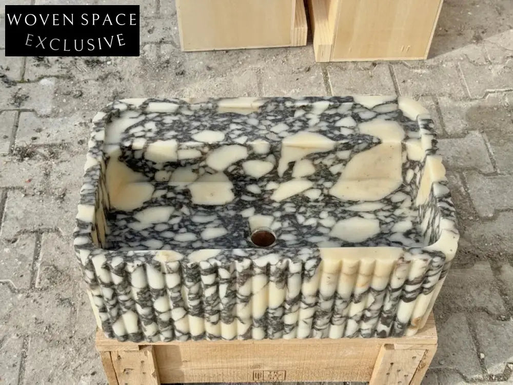Armani ribbed Calacatta Viola marble sink