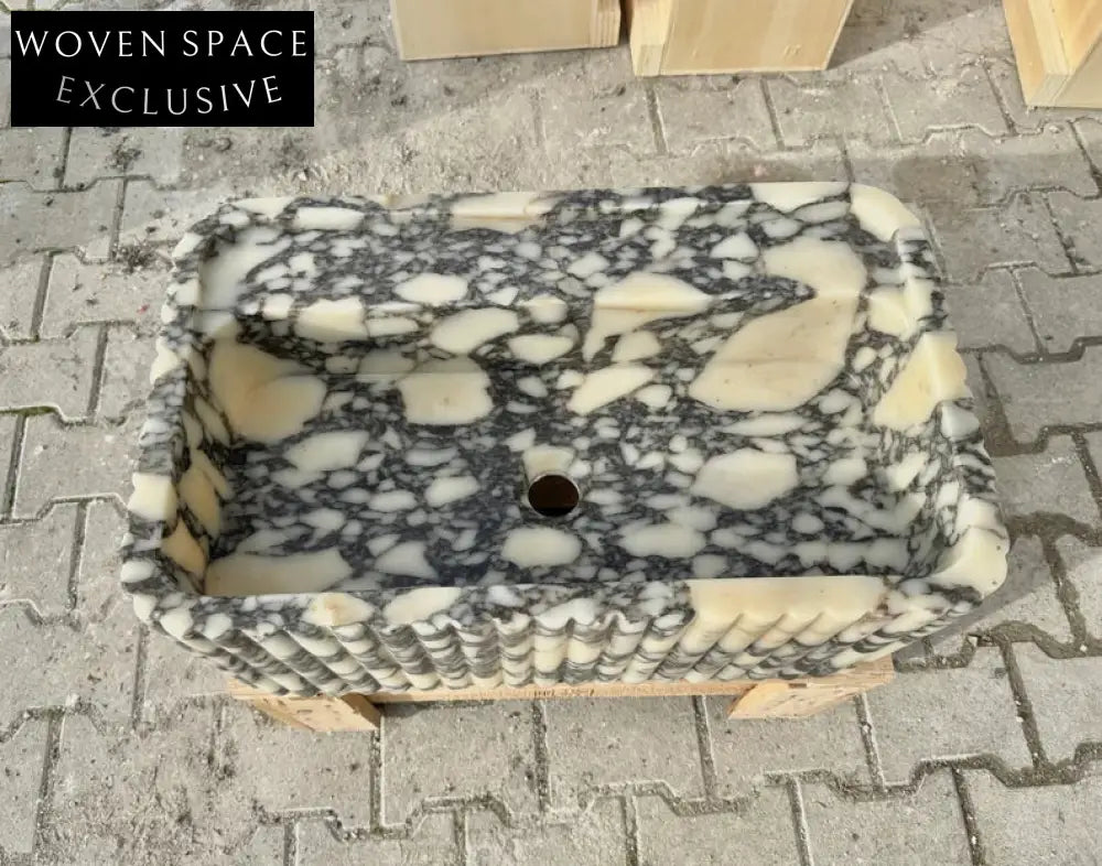Armani ribbed Calacatta Viola marble sink