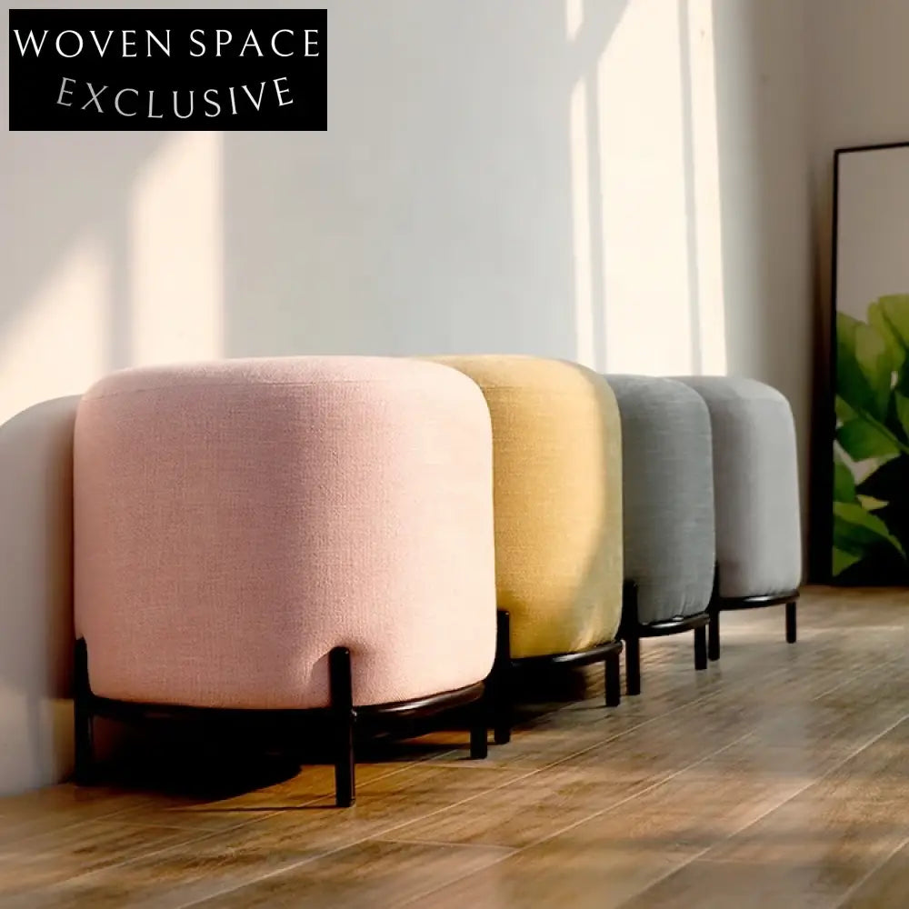 Chic Round Fabric Ottoman Stool with Black Metal Legs for Modern Spaces