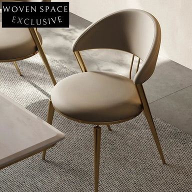 Elegant Modern Dining Chair with Curved Backrest, Stainless Steel Frame, PU Leather