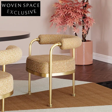 Elegant Pink Velvet Dining Chair with Gold Legs and Comfortable Armrests