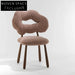 Luxurious Teddy Fabric Dining Chair with Solid Wood Legs for Modern Homes